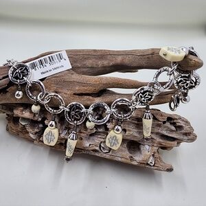 Elegant Silver and Cream Charm Bracelet